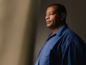 An older adult looking pensive.